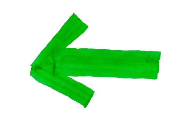 Green arrow isolated on a white background Arrow sign drawn with green marker pen